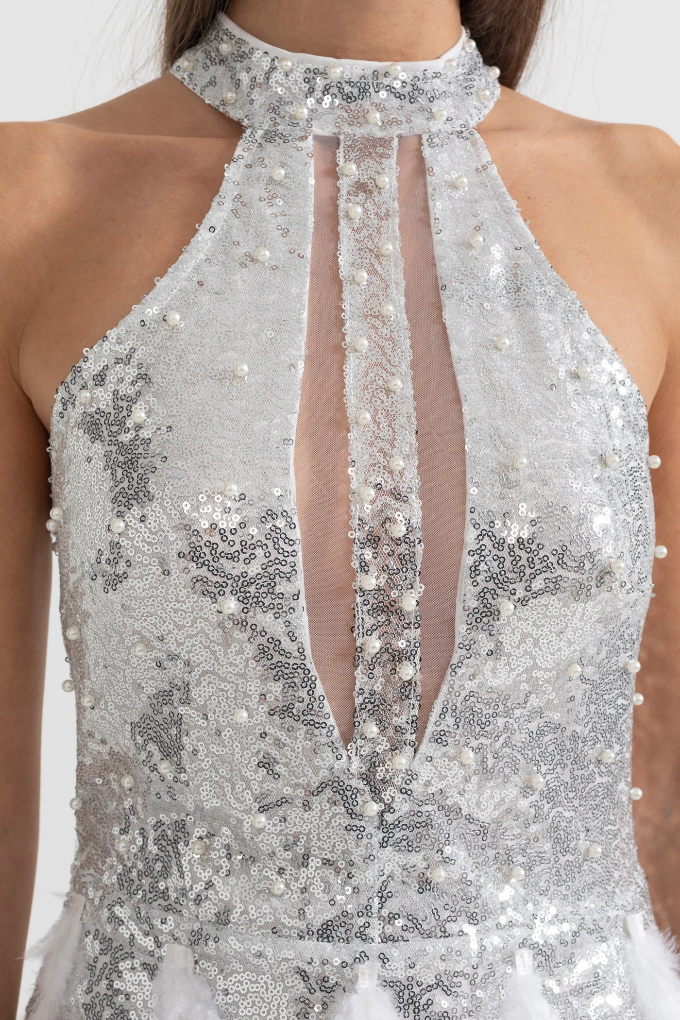 Sparkling Sequin Mini Dress With Front Sheer Cutouts And Feather Embellishments - Silver
